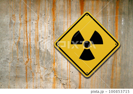 Radioactive warning sign on a wall Radioactive warning sign on a wall 100853715