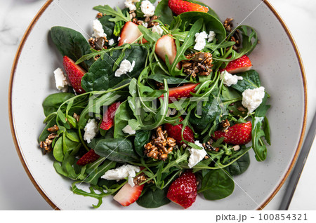 Green Salad with Strawberries, Feta Cheese, Seeds Green Salad with Strawberries, Feta Cheese, Seeds 100854321