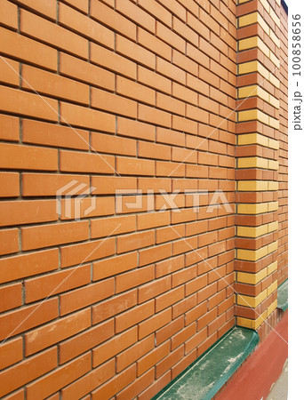 brick new modern expensive outdoor fence to the street. Post a text, the concept of health, protection, reliability brick new modern expensive outdoor fence to the street. Post a text, the concept of health, protection, reliability 100858656