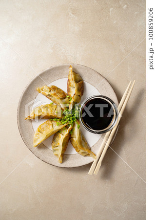 Fried dumplings gyoza with soy sauce, and chopsticks. Fried dumplings gyoza with soy sauce, and chopsticks. 100859206