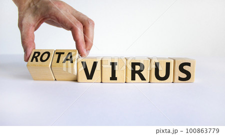 Virus or rotavirus symbol. Doctor turns cubes and changes the word 'virus' to 'rotavirus'. Beautiful white background. Medical, virus or rotavirus concept. Copy space. Virus or rotavirus symbol. Doctor turns cubes and changes the word 'virus' to 'rotavirus'. Beautiful white background. Medical, virus or rotavirus concept. Copy space. 100863779