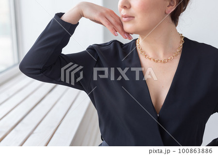 Elegant woman close-up wearing gold necklace. Woman wearing jewellery. Jewellery photo for e commerce and online sale social media Elegant woman close-up wearing gold necklace. Woman wearing jewellery. Jewellery photo for e commerce and online sale social media 100863886
