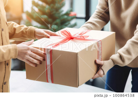 a person receives a gift for the holiday. concept of celebration and attention 100864538