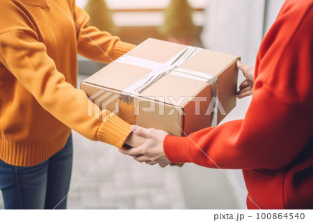 a person receives a gift for the holiday. concept of celebration and attention a person receives a gift for the holiday. concept of celebration and attention 100864540