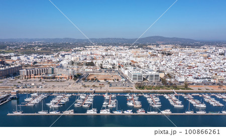 Aerial view of the Portuguese fishing tourist town of Olhao overlooking the Ria Formosa Marine Park. sea port for yachts Aerial view of the Portuguese fishing tourist town of Olhao overlooking the Ria Formosa Marine Park. sea port for yachts 100866261