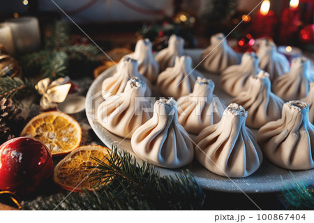 top view of georgian or armenian khinkali food with meat or cheese on christmas 100867404