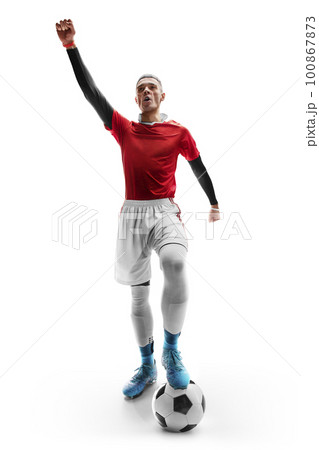 Winner. Professional soccer player with a ball. Foot on the ball. View from the front. Isolated on white background Winner. Professional soccer player with a ball. Foot on the ball. View from the front. Isolated on white background 100867873
