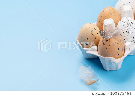 Eggs pack on a blue background 100875463