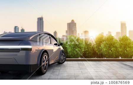 Ev car or electric vehicle park in town with cityscape background 100876569