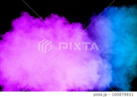 Launched blue pink dust particles splashing.Bizarre forms of blue pink powder explosion cloud on white background. Launched blue pink dust particles splashing.Bizarre forms of blue pink powder explosion cloud on white background. 100879831