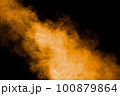 Abstract explosion of orange dust on black background.Freeze motion of orange powder burst. 100879864