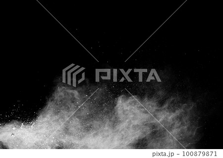 White powder explosion cloud against black background. White dust particles splash. 100879871