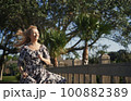 Happy retro styled woman running on the wooden bridge 100882389