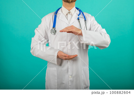 close up of male doctor holding something in his hand. Help and care concept close up of male doctor holding something in his hand. Help and care concept 100882604