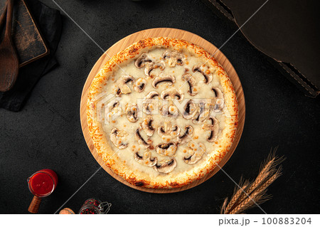 Top view on pizza with mushrooms and cheese 100883204