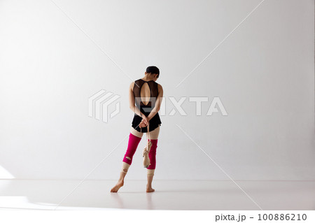 Back view. Graceful classical dance training over white background. Beauty and grace. Copy space for ad Back view. Graceful classical dance training over white background. Beauty and grace. Copy space for ad 100886210