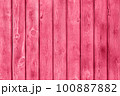 Trendy color of the year 2023. Wooden planks boards, vertical pattern, toned in viva magenta color as background or texture 100887882