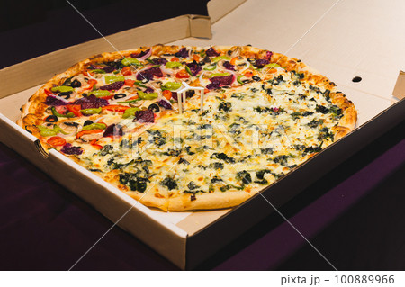 New York style pizzas takeout isolated in black background. 100889966