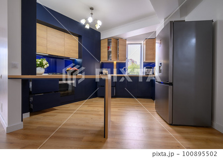 Luxury large blue and wood colored kitchen Luxury large blue and wood colored kitchen 100895502