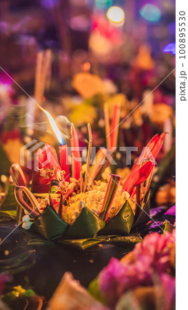 Loy Krathong festival, People buy flowers and candle to light and float on water to celebrate the Loy Krathong festival in Thailand 100895530
