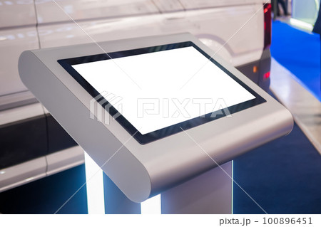 Electronic multimedia tablet kiosk with blank white display at exhibition 100896451