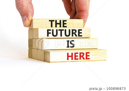 The future is here symbol. Concept words The future is here on wooden block. Beautiful white table white background. Businessman hand. Motivational business the future is here concept. Copy space. 100896873