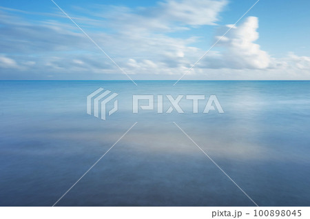 Blue smooth sea water with sky 100898045