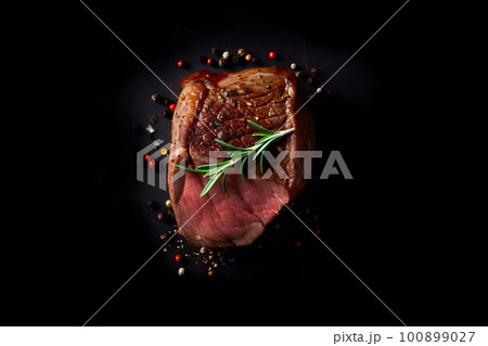 Just grilled medium rare beef steak with spices, top view at dark background, AI generative image 100899027