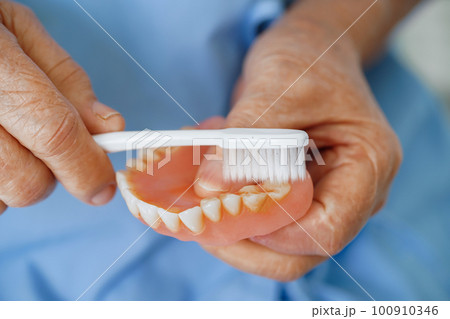 Doctor help Asian elderly woman disability patient sitting on wheelchair in hospital, medical concept. 100910346