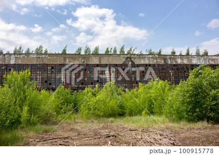 The abandoned old factory building outside 100915778
