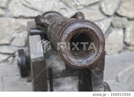medieval cannon in an old abandoned castle 100915930