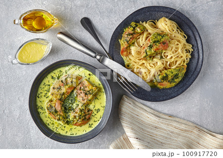 Chkemeruli, noodles with fried chicken, on a dark plate with cut 100917720