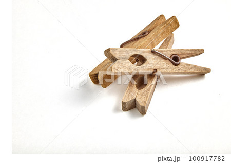 Group of dilapidated vintage wooden clothespins isolated on white background Group of dilapidated vintage wooden clothespins isolated on white background 100917782
