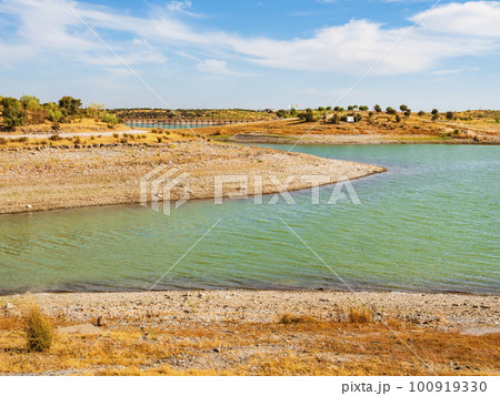 Impressive view of Alqueva lake with emerald waters and barren stony coasts, Monsaraz, Portugal Impressive view of Alqueva lake with emerald waters and barren stony coasts, Monsaraz, Portugal 100919330