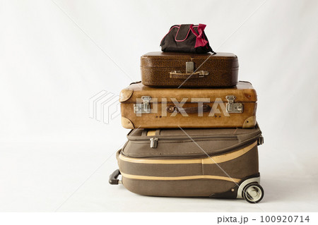Pile of different suitcases. 100920714