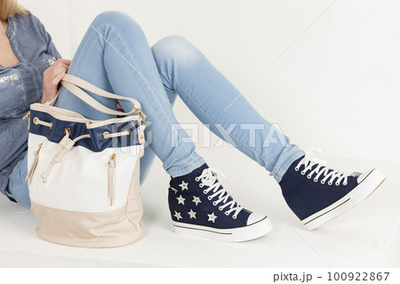 Young woman wearing fashionable shoes Young woman wearing fashionable shoes 100922867
