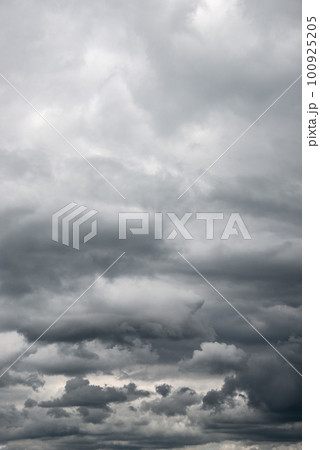 Cover page with dramatic rainy and stormy sky with heavy clouds as a background with copy space. 100925205