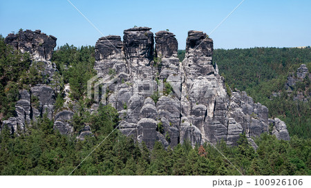 Monumental Bastei sandstone pillars and rock formation near Kurort Rathen village in the national park Saxon Switzerland by Dresden and Czechish border, Saxony, Germany. 100926106