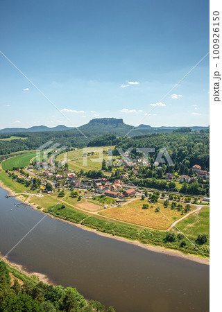 Cover page with birdview over Lilienstein table like sandstone pillar, Bastei rocks near Kurort Rathen village in the national park Saxon Switzerland by Dresden and Elbe river with blue sky, Saxony, Cover page with birdview over Lilienstein table like sandstone pillar, Bastei rocks near Kurort Rathen village in the national park Saxon Switzerland by Dresden and Elbe river with blue sky, Saxony, 100926150