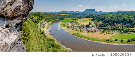 Panoramic birdview over monumental Bastei sandstone pillars near Kurort Rathen village in the national park Saxon Switzerland by Dresden and Elbe river, Saxony, Germany. Panoramic birdview over monumental Bastei sandstone pillars near Kurort Rathen village in the national park Saxon Switzerland by Dresden and Elbe river, Saxony, Germany. 100926157
