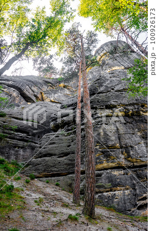 Monumental ancient Bastei sandstone pillars near Kurort Rathen village in the national park Saxon Switzerland by Dresden and Czechish border, Saxony, Germany. Monumental ancient Bastei sandstone pillars near Kurort Rathen village in the national park Saxon Switzerland by Dresden and Czechish border, Saxony, Germany. 100926173