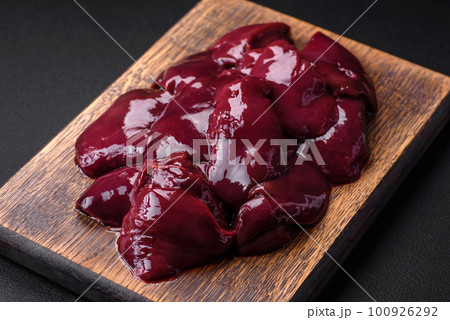 Fresh raw chicken, turkey or duck liver with salt, spices and herbs Fresh raw chicken, turkey or duck liver with salt, spices and herbs 100926292