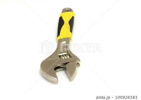 Adjustable metal old spanner on a white background. 100926583