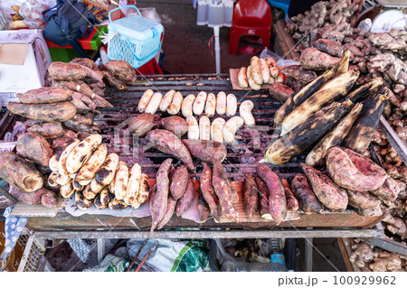 Local Thai villagers selling food and souvenirs in stalls along the popular road route between Mae Hong Son and Pai, Northern Thailand. Local Thai villagers selling food and souvenirs in stalls along the popular road route between Mae Hong Son and Pai, Northern Thailand. 100929962