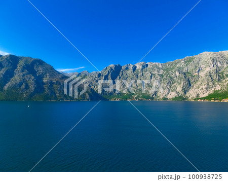 Village on coast of Boka Kotor bay - Montenegro - nature and architecture background Village on coast of Boka Kotor bay - Montenegro - nature and architecture background 100938725