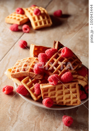 Belgian waffles with raspberries. Belgian waffles with raspberries. 100943444
