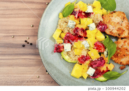 Meat salad with citrus fruits, cheese and quinoa Meat salad with citrus fruits, cheese and quinoa 100944202