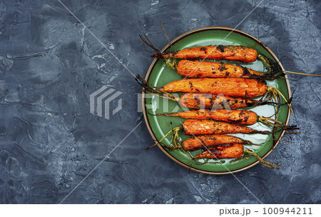 Appetizing baked carrots, copy space Appetizing baked carrots, copy space 100944211