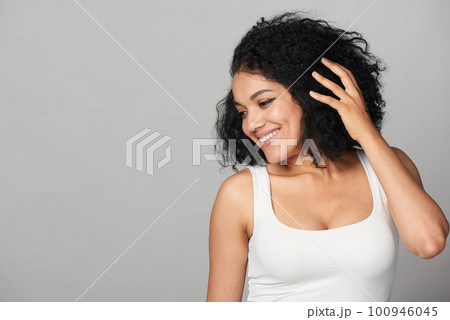 Happy smiling mixed race girl looking to side at blank copy space Happy smiling mixed race girl looking to side at blank copy space 100946045