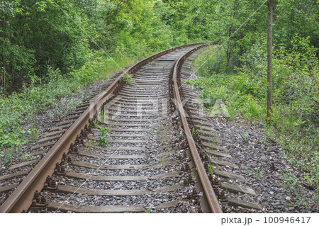 old rusty abandoned railway overgrown with grass old rusty abandoned railway overgrown with grass 100946417
